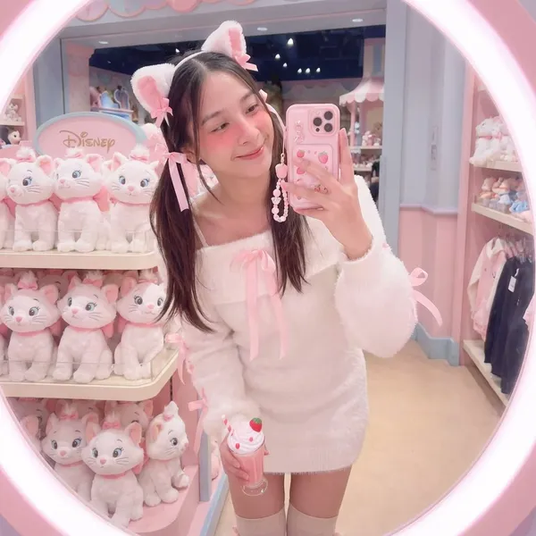 Woman Taking Selfie in Mirror at Disney Store