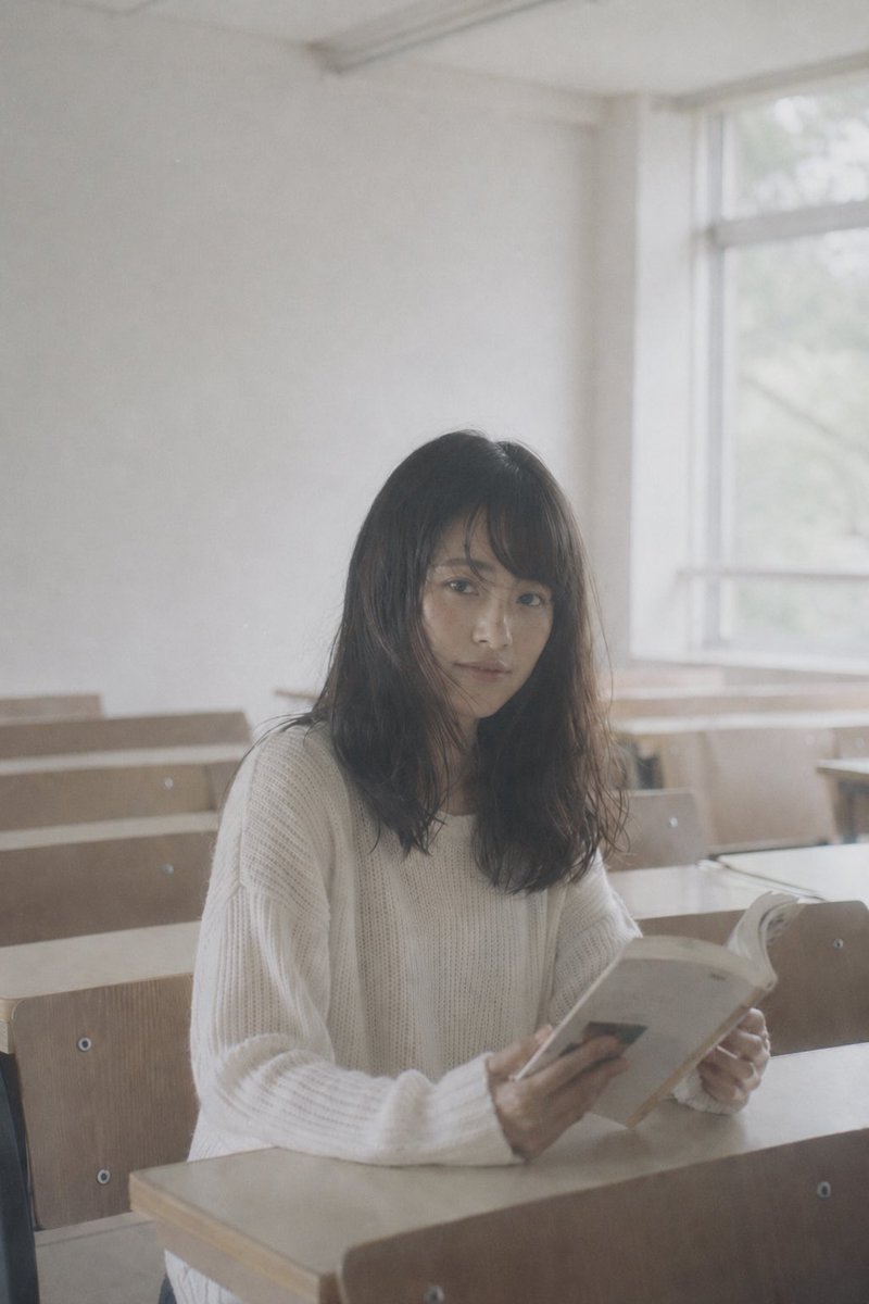 Faceless Student Reading in Classroom