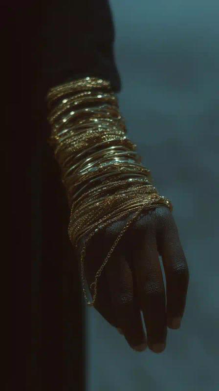 Gold Bracelets on Arm
