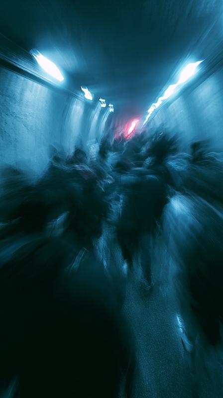 Blurry chaotic timelapse of a faceless crowd moving rapidly...
