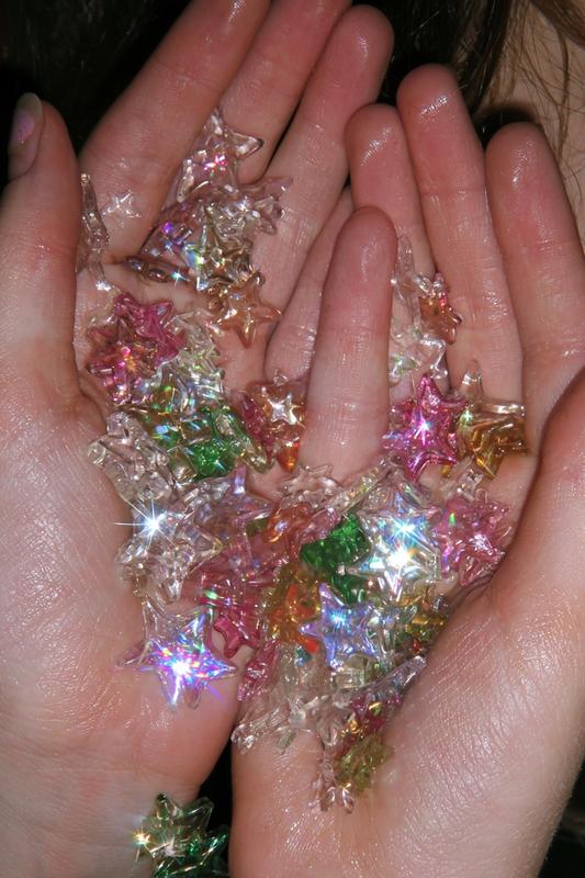 00s macro candid shot a girl's palms holding many...