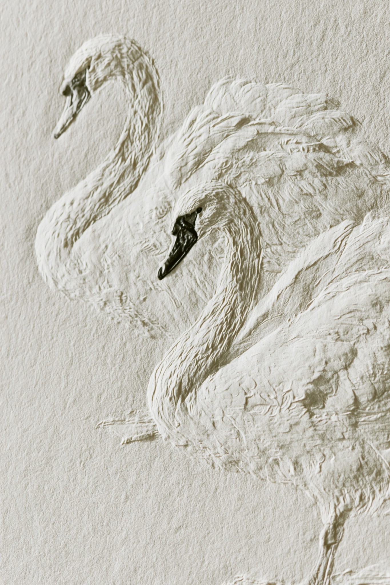 a refined design of 2 swans pressed into thick...