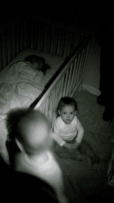 grainy monochrome baby monitor footage night vision security camera...
