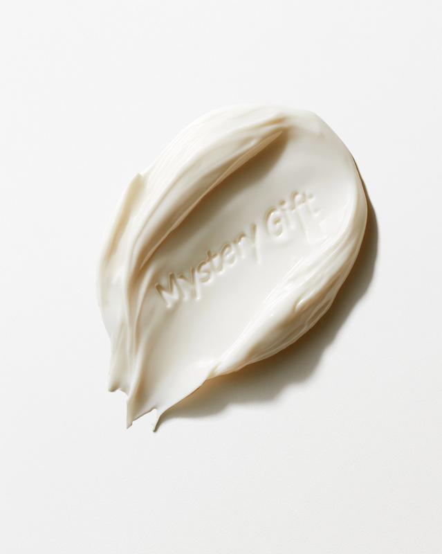 A single solid white-colored swatch of cosmetic cream on...