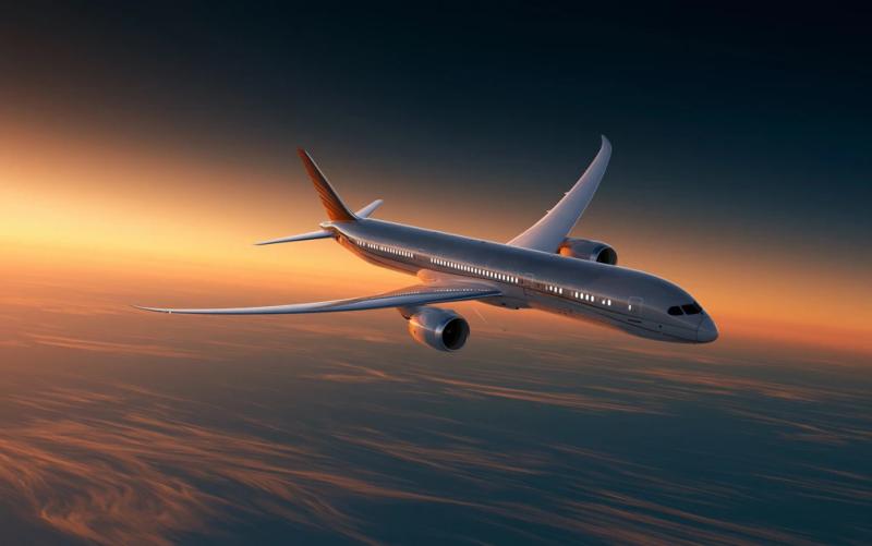 sleek modern commercial jet aircraft in dramatic three-quarter view...
