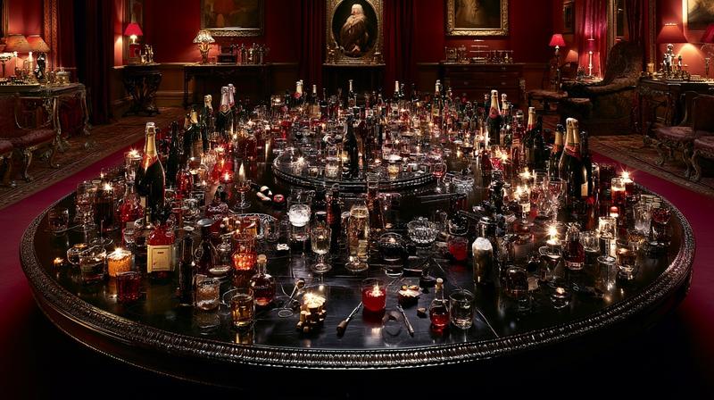 an oval royal round table covered in drinks bottles...