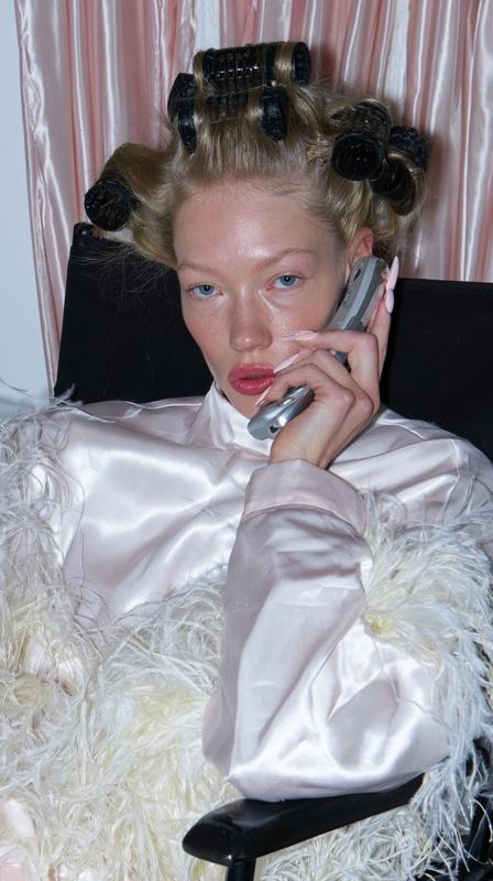 A direct shot of a young white woman in...