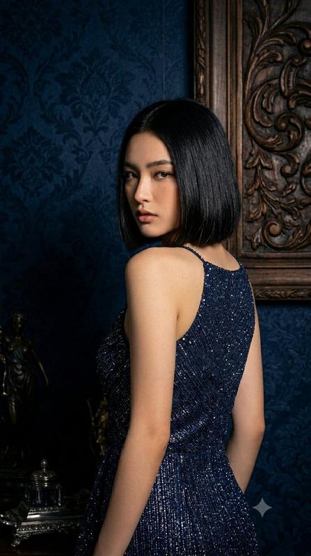 Elegant woman in glittery navy dress