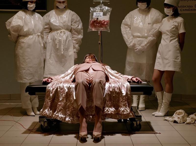 Fashion advertising a rose infusion is administered into a...