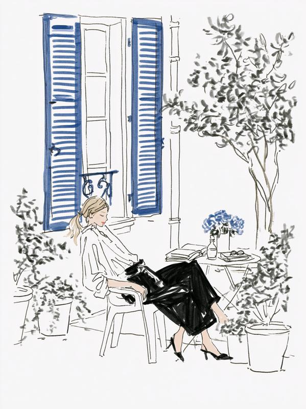 a person outside in a french courtyard leaning back...