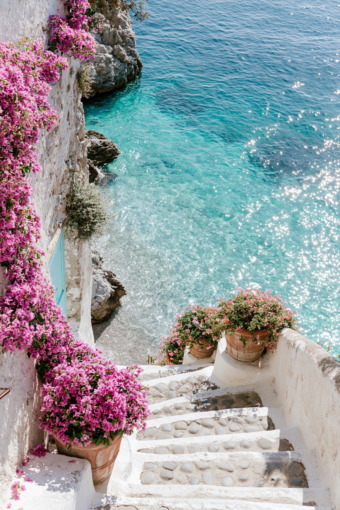 Dreamy hidden Amalfi Coast pathway descending toward a secluded...