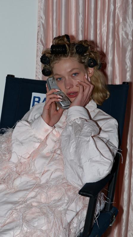 A direct shot of a young white woman in...