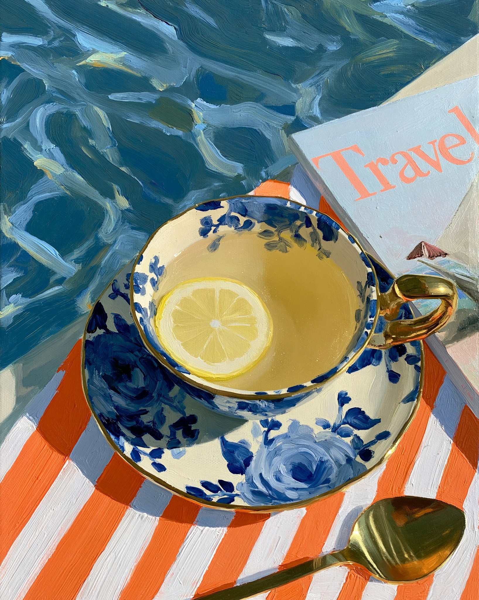 a ceramic teacup and saucer set adorned with blue...