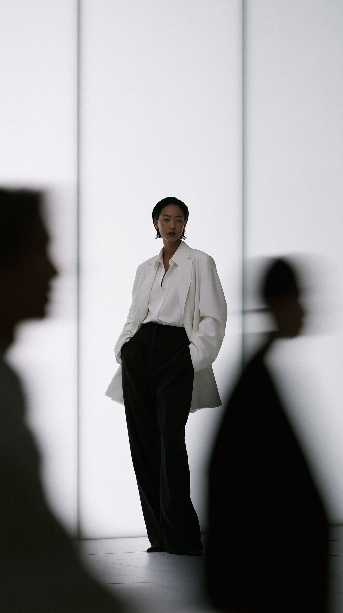 In fashion editorial photography blurred long-exposure figures fill the...
