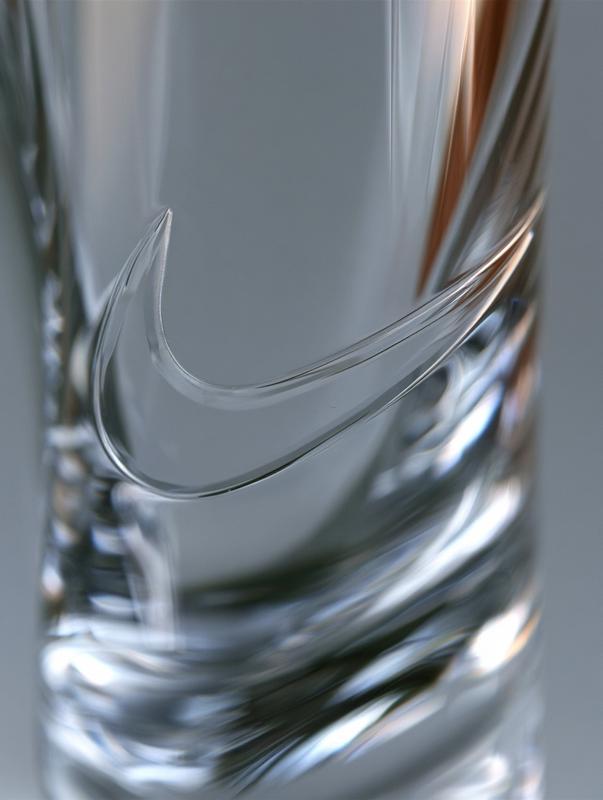 clear crystal engraved swoosh transparent embossed logo integrated into...