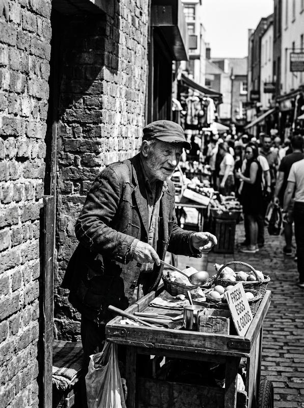 Gritty Black-and-White Street Vendor